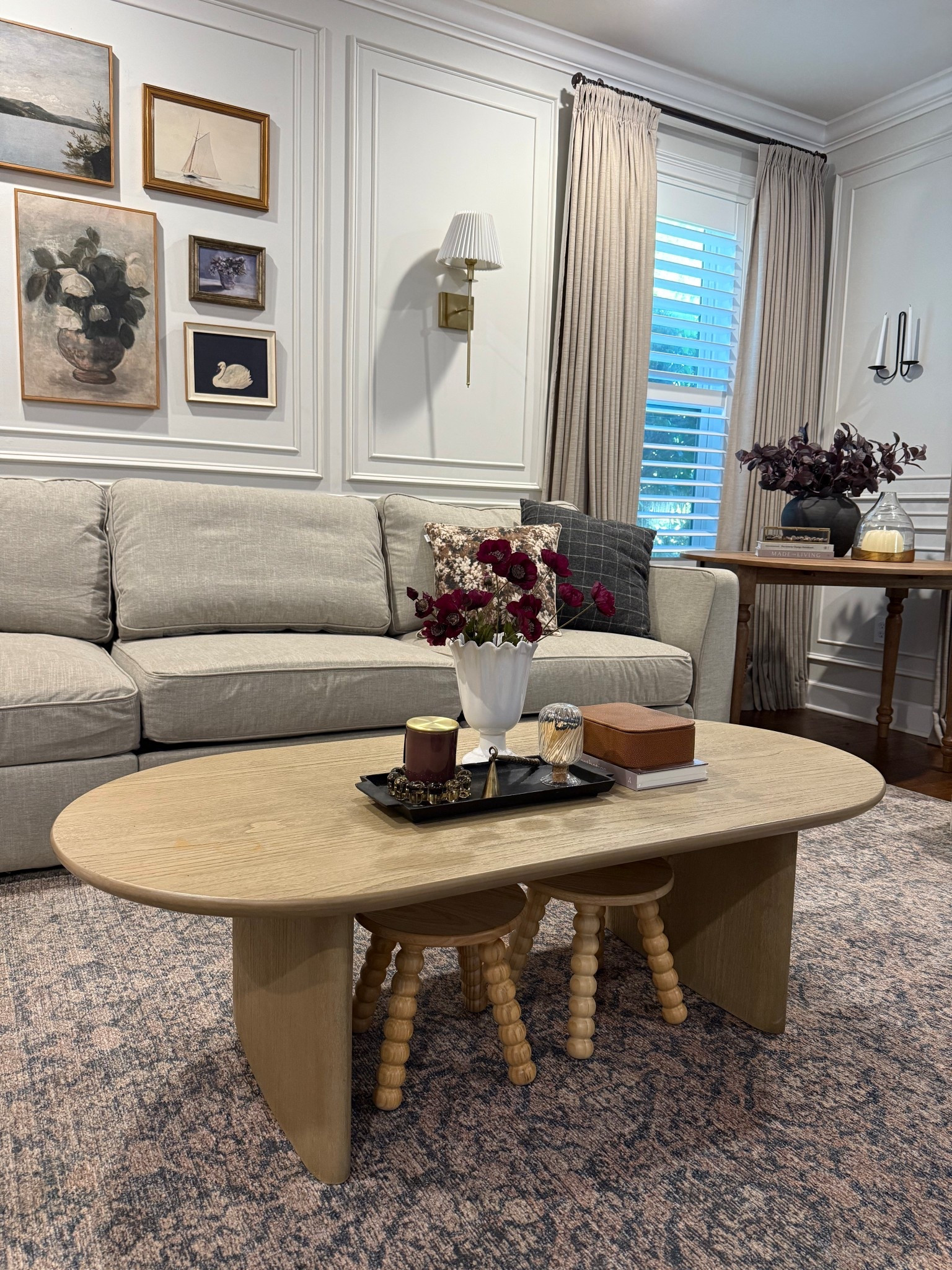 Oval coffee table
Natural wood accent table 
Black rounded edge world market 
Zeke furniture 
Family room 

#LTKSaleAlert #LTKStyleTip #LTKHome