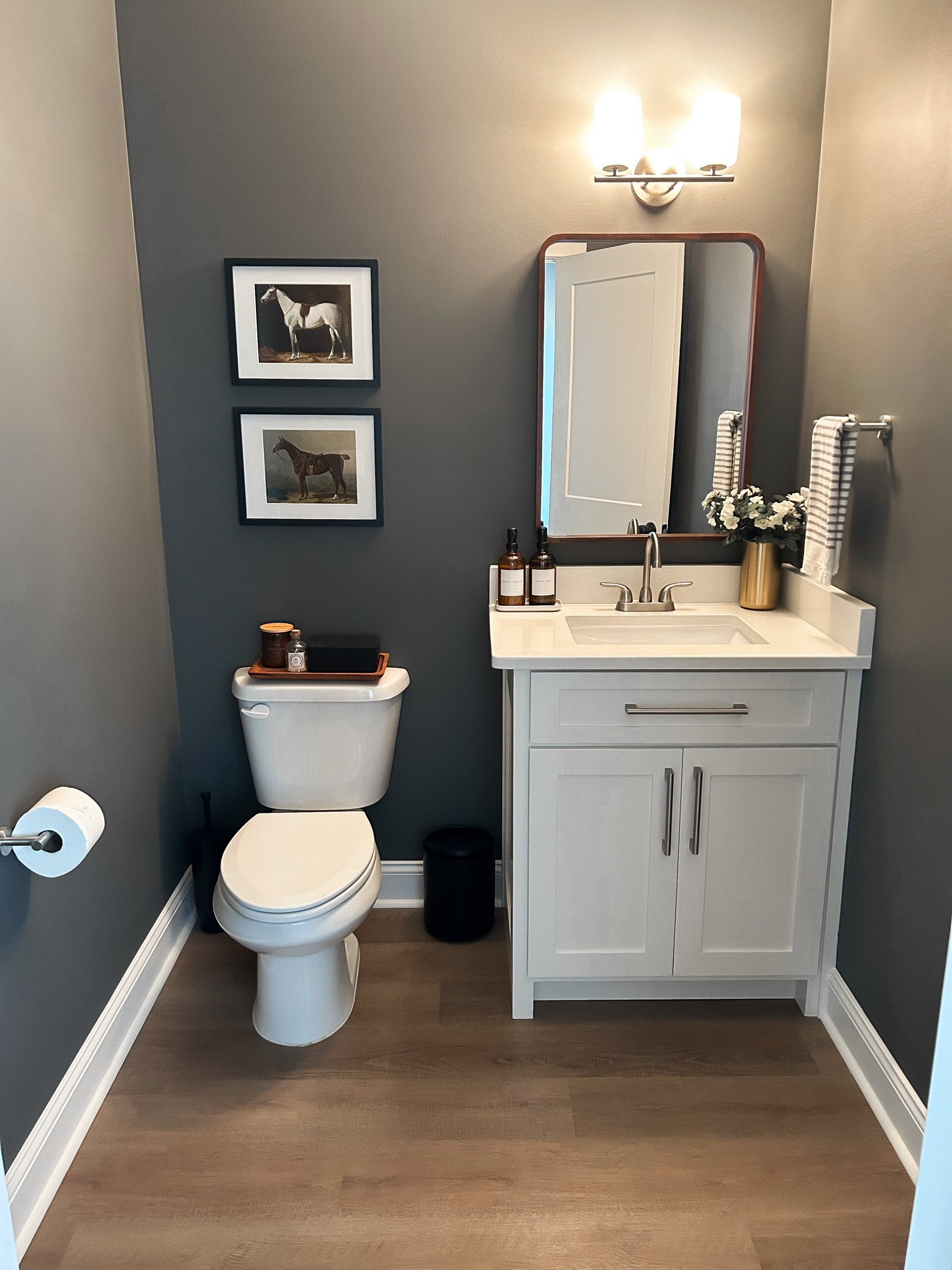 A moody, equestrian guest bath update! Paint color: Kendall Charcoal - Benjamin Moore

#LTKfindsunder50 #LTKhome #LTKfindsunder100