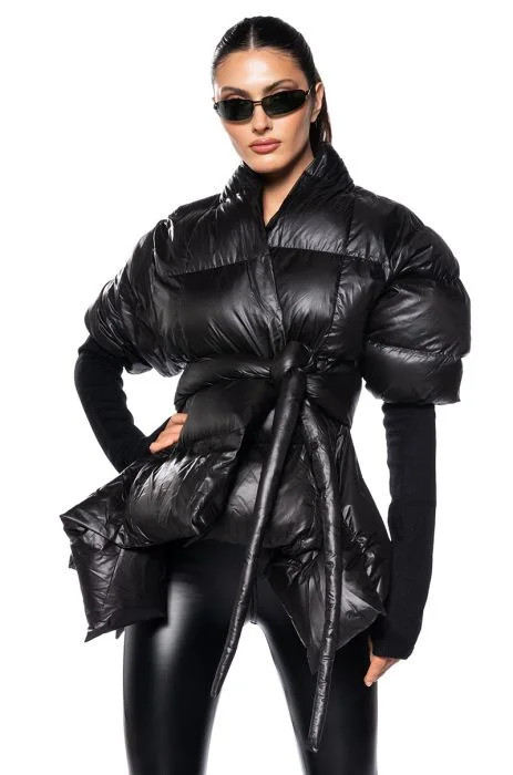 A STEP AHEAD LONG RIBBED SLEEVE PEPLUM PUFFER COAT IN BLACK | AKIRA