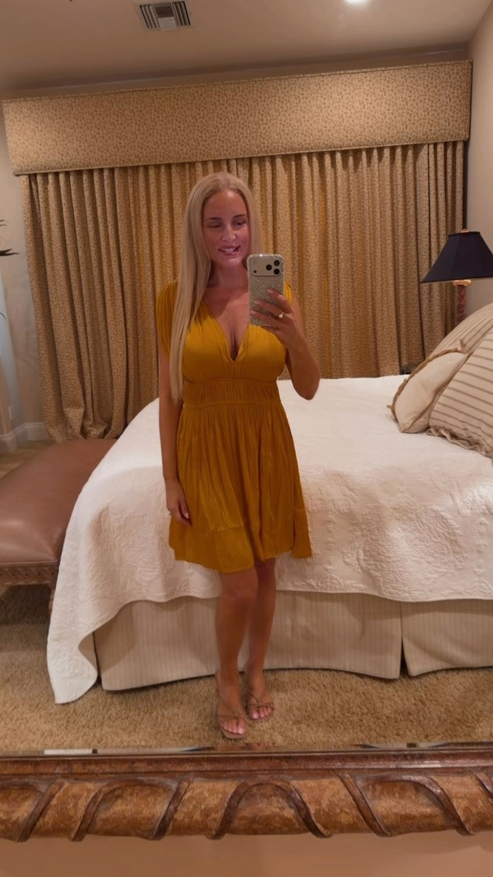 This beautiful mustard dress is perfect for a fall beach vacation outfit. Works as a coverup too. Runs big, size down.