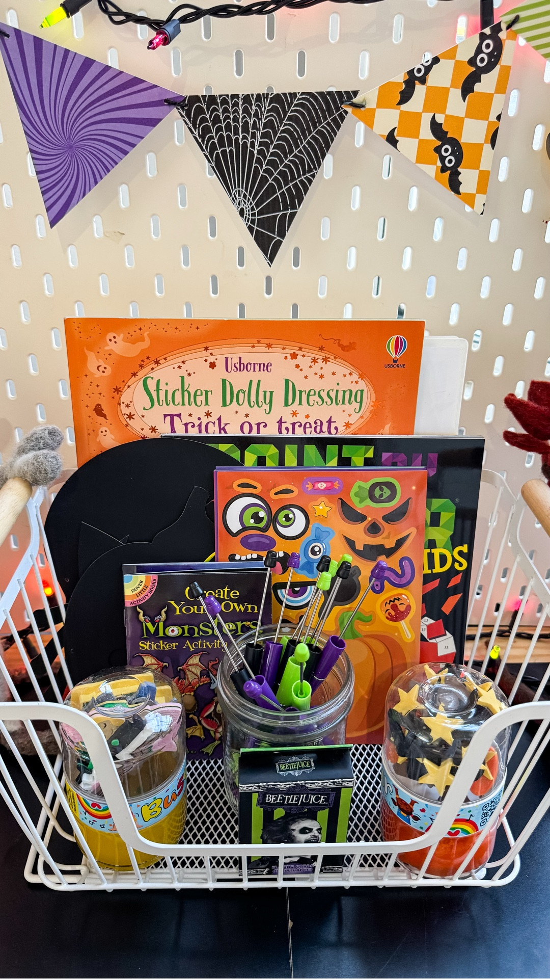 This is now the do not tell me you’re bored basket! It’s our everything every day bin.
Thankfully, it’s rare for the kids to say they’re bored but when they do, I point straight to the basket. We have stickers, jewelry making, busy jars, morning menus and even playing cards. 
I do think the scratch Halloween masks are the new favorite.

#LTKSeasonal #LTKKids #LTKHalloween