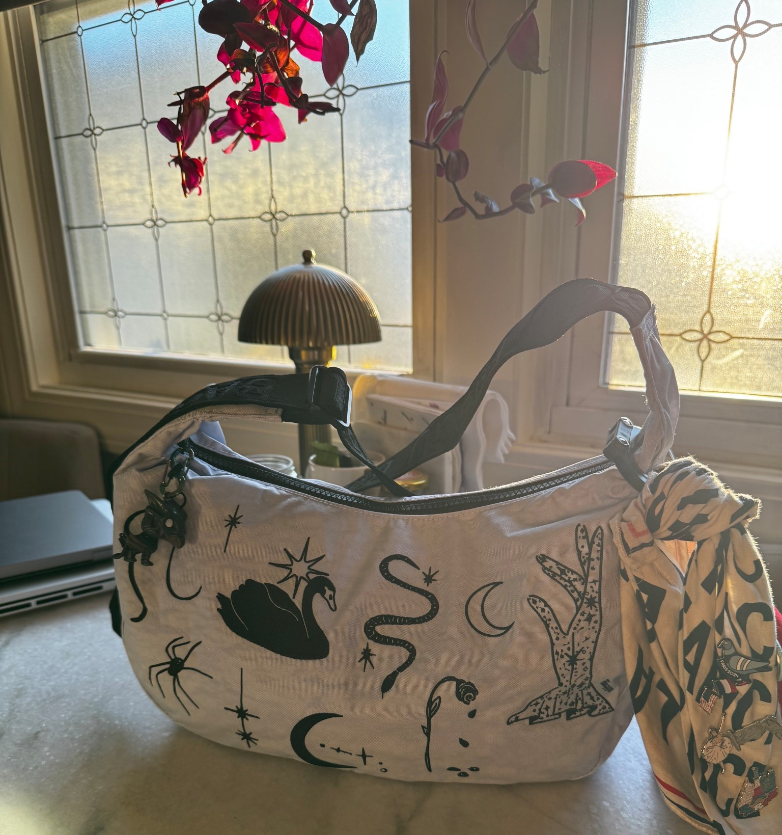 Influenced by another creator to pick up the Baggu Medium Crescent in my favorite pattern, Swan Lake. Love that it has romantic yet spooky vibes! Should I share a video of what I carry in here? #baggu 

#LTKStyleTip #LTKSeasonal #LTKFindsUnder100