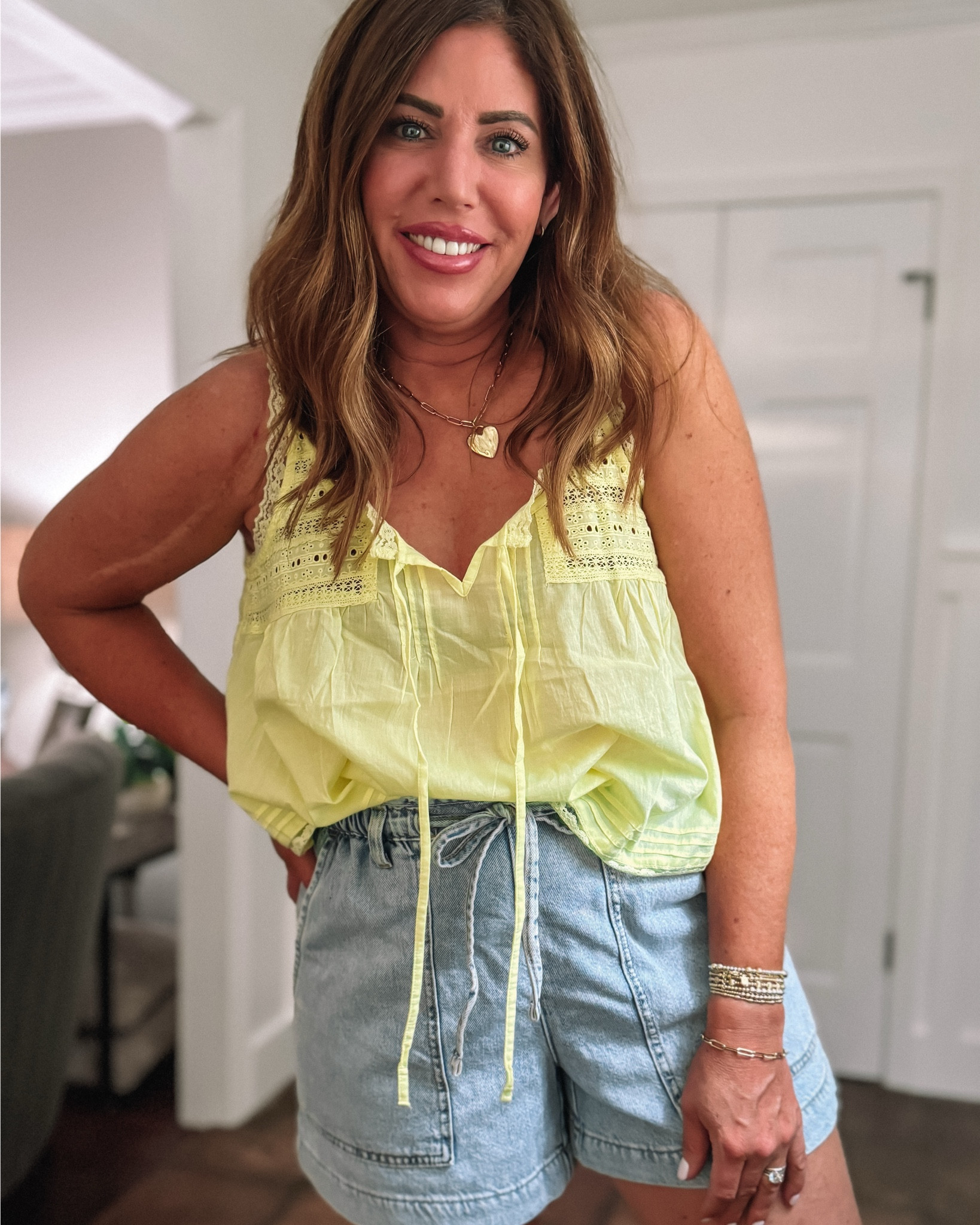 Super cute spring & summer outfit—perfect for vacation!

Free people look for less cotton/lace tank/size medium. I also picked this up in White.

Paper bag shorts are super comfy and flattering. I’m wearing a size 8.

Slide sandals are from Amazon. They’re very comfortable and true to size.



#LTKMidsize #LTKootd #LTKOver40