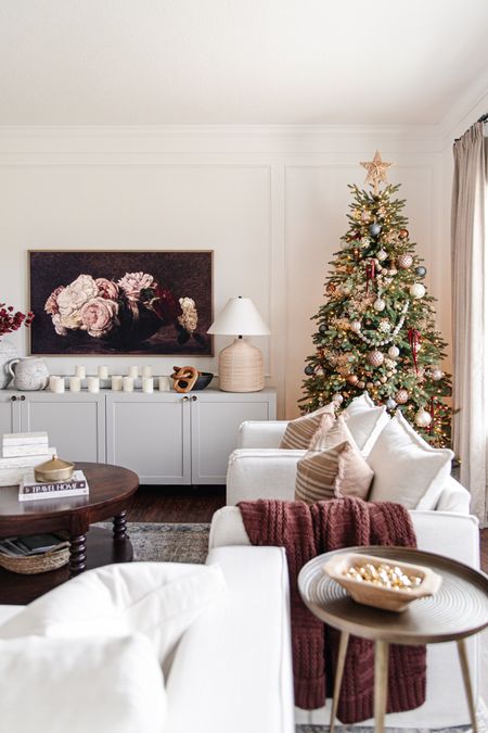 Cozy christmas living room with pre lit tree, linen berea chairs, maroon burgundy blanket, plaid throw pillows, loloi rug, and samsung frame tv.

#LTKhome #LTKHoliday #LTKSeasonal