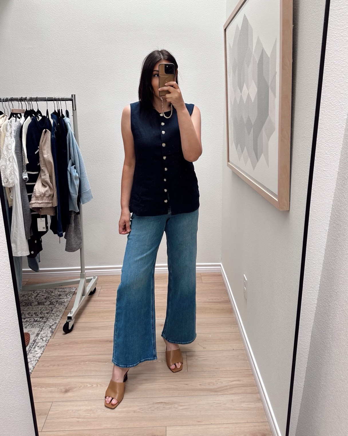 I have this vest in black and navy! It’s a softer linen that moves beautifully, not stiff at all. I am in the large for extra wiggle room at the chest, overall I find it runs TTS.

I'm in the 30 of the jeans!  

 