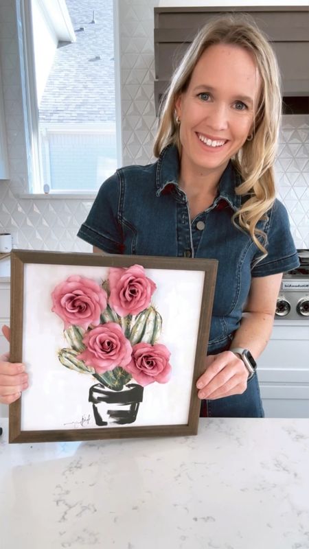 Sharing my denim jumpsuit and makeup in this video  

How to add faux florals to a painting:  Snip off a few flowers, leaving a long stem. Drill a small hole if it’s made of wood, or for canvas paintings use a razor blade, where you want the flower to be placed. Insert the flower into the hole and tape the stem in back. 

I set this up for some spring decor for my daughter’s bookshelf! Thank you for being here and please let me know if I can be of any help!

#LTKSeasonal #LTKstyletip #LTKVideo