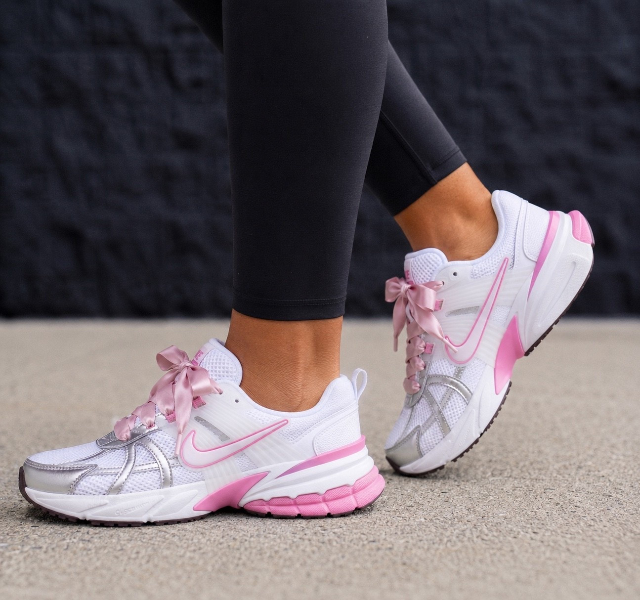 Nike V2K Run. These are giving the prettiest sporty girl vibes. 💗 The silver reflective details paired with the soft pink accents make them the perfect everyday sneaker to elevate any athleisure look. They’re lightweight, super comfortable, and easy to style with leggings, denim, or your favorite matching set.

Fit: Runs true to size. If you’re between sizes or prefer a little extra room, you may want to go up a half size.