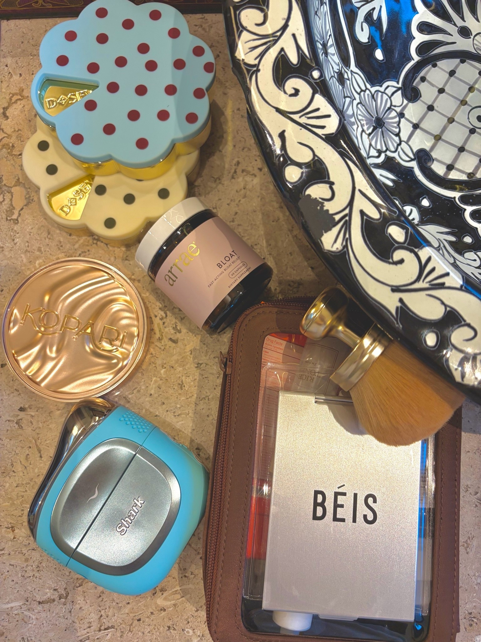 A few things that have officially become vacation essentials for me ✈️🌴 My Shark Depuffi has been SO good for my morning puffiness. I’ve literally done one side of my face at a time just to make sure I wasn’t imagining it, and the difference is crazy 😂 I also brought my super cute Dosey pill cases for all of my daytime + nighttime vitamins and supplements, Arrae Bloat because vacation food is vacation food and I refuse to be uncomfortable in my bikini the next day 😂, my Kopari Sun Shield Body Glow for SPF + shimmer, and of course my BÉIS cosmetic cases. I use the smaller one for skincare and the larger one for makeup, and the clear windows make finding everything SO much easier. Linking all of my vacation must-haves here! 🤎

#LTKTravel #LTKselfcare #LTKmorningroutine