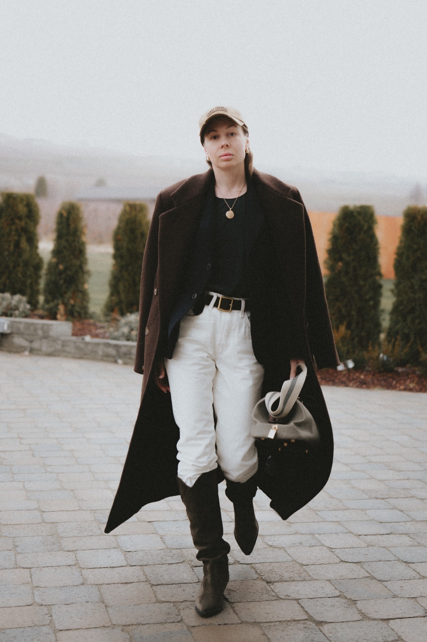 Sharp shoulder coats are in. 
Styled with Levi’s 501 off white jeans, Isabel Marant denvee boots, Buck Mason Shrunken academy blazer.
Bag: vintage Celine doctors bag.
Jewelry: David Yurman. 
Baseball hat: Golden Goose. 

#LTKootd