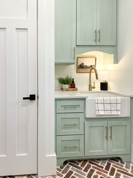 My laundry room sink and laundry cabinets

Gold cabinet hardware
Gold Cabinet pulls
Gold sink faucet
White laundry sink
Small lamp
Textured lamp
Laundry room
Modern farmhouse decor
Laundry room decor 
Sea salt Sherwin williams 
Spring decor

#LTKFind #LTKhome #LTKSeasonal