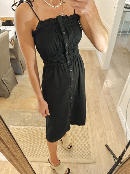 $30 black linen dress perfect for spring summer. Throw a cardigan over for now when the days are a little cool dress up or down with sneakers. Comes in 6 color options (I’ve shared this dress in the pink color also) easy throw on. Has pockets. Tie shoulder straps buttons all the way down and runs tts. Wearing size xs here 

#LTKFind #LTKworkwear #LTKunder50