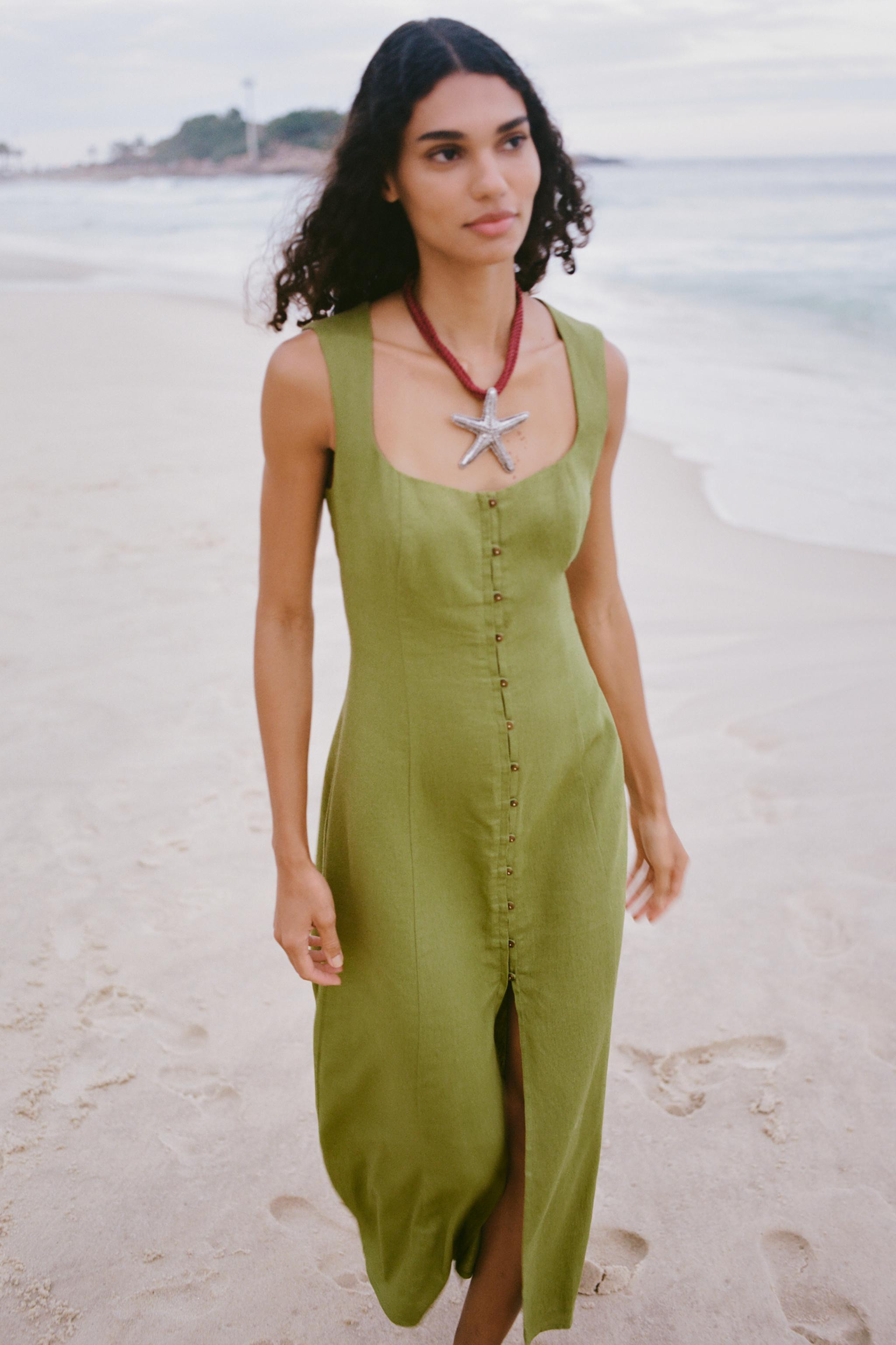 Dress made with linen. Square neckline and sleeveless design. Featuring decorative buttons on the... | Zara UK