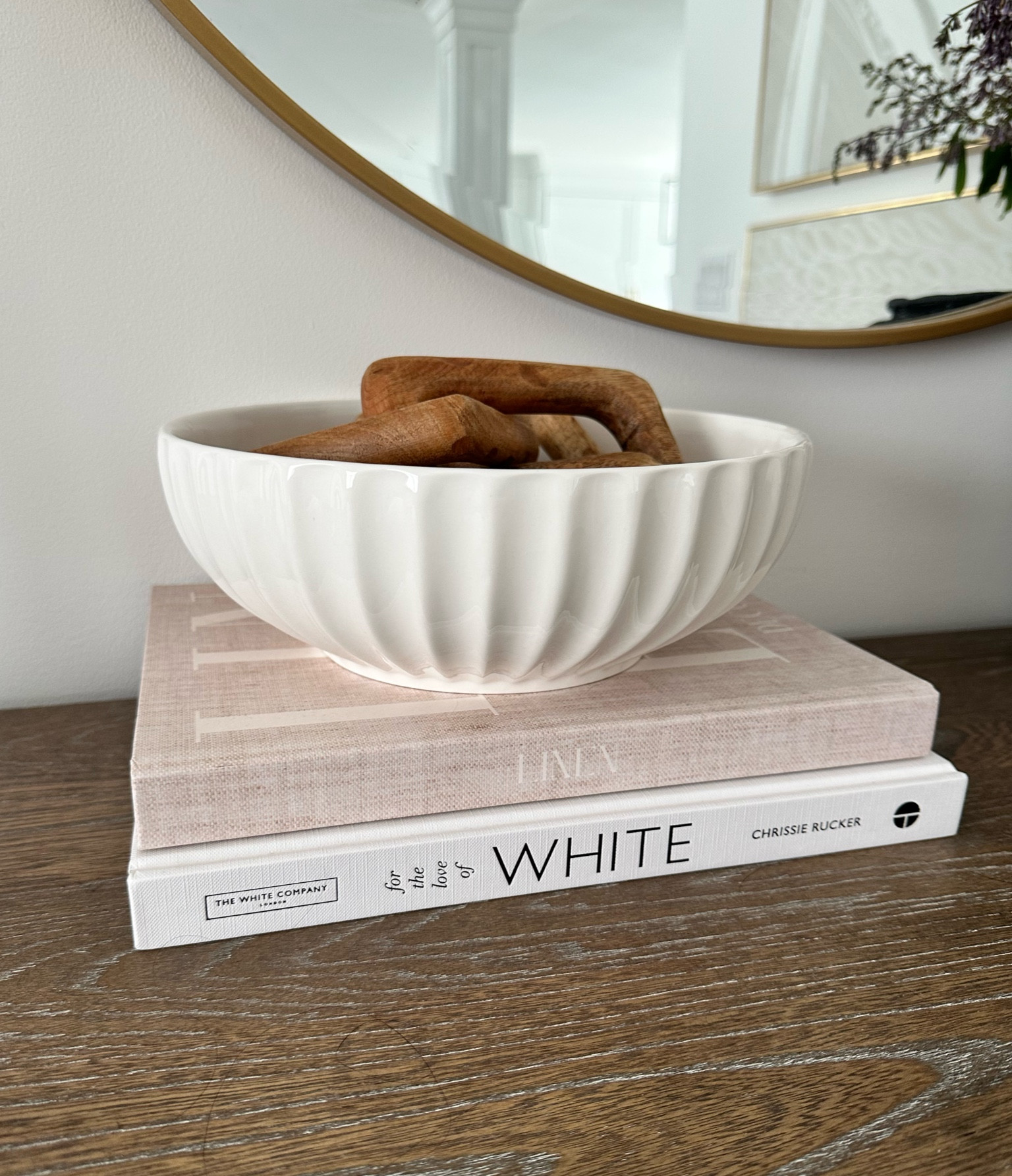 Fluted ceramic white bowl, trending home decor, white coffee table book, linen coffee table book, wood chain link, gold mirror, wood sideboard, wavy bowl, 

#LTKhome