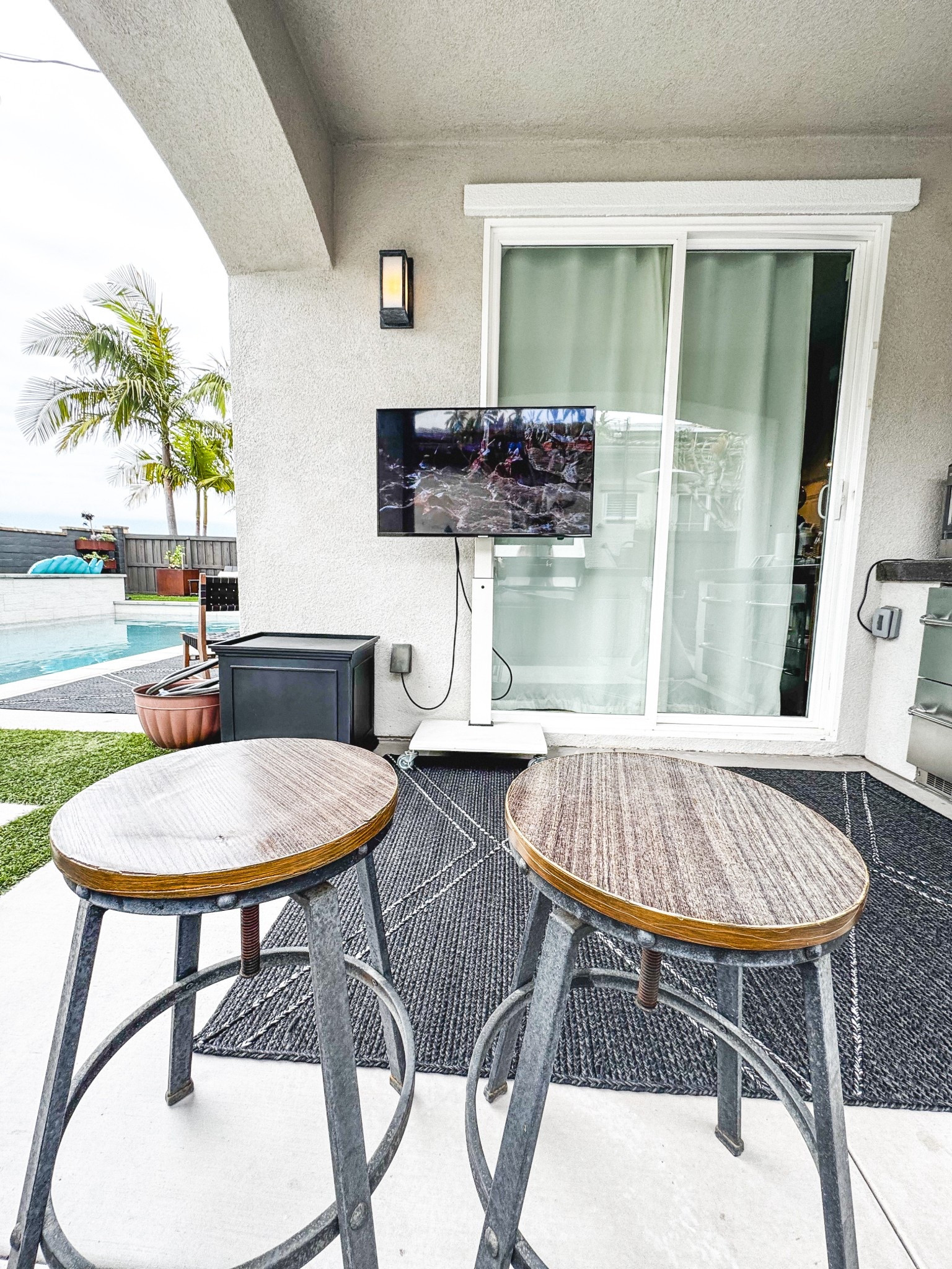 Watch TV anywhere with a TV stand or on castors and Apple TV!  Easy to store away for the summer, and no tools or permanent damage to walls. With Apple TV you can use your phone as the remote! 
#outdoorTV
#outdoorliving
#outdoorspaces
#backyardliving
#patioliving 


#LTKSeasonal #LTKHome #LTKWatchNow