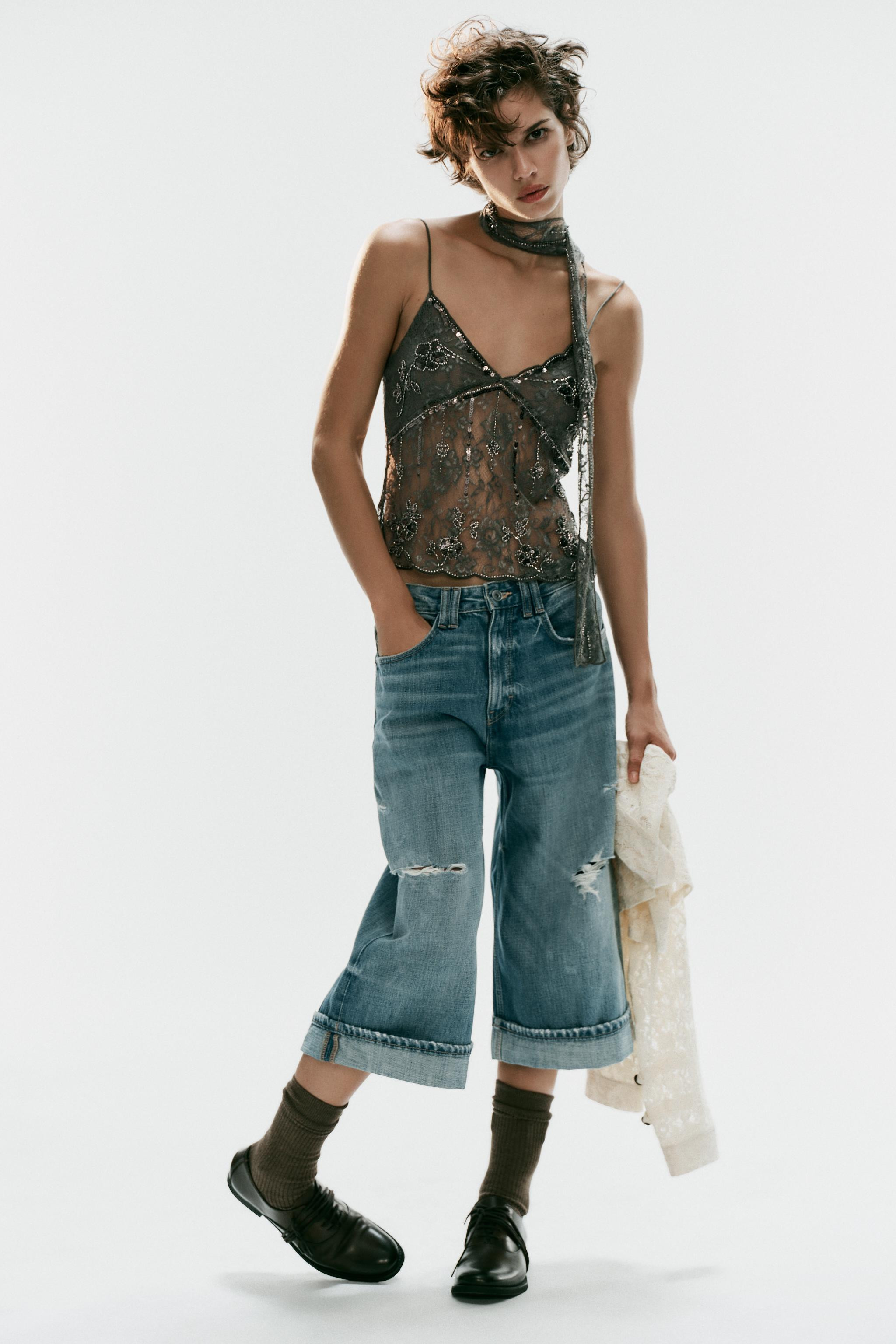 Top crafted from a polyamide blend. V-neckline with neck scarf detail and thin straps. Features c... | Zara US