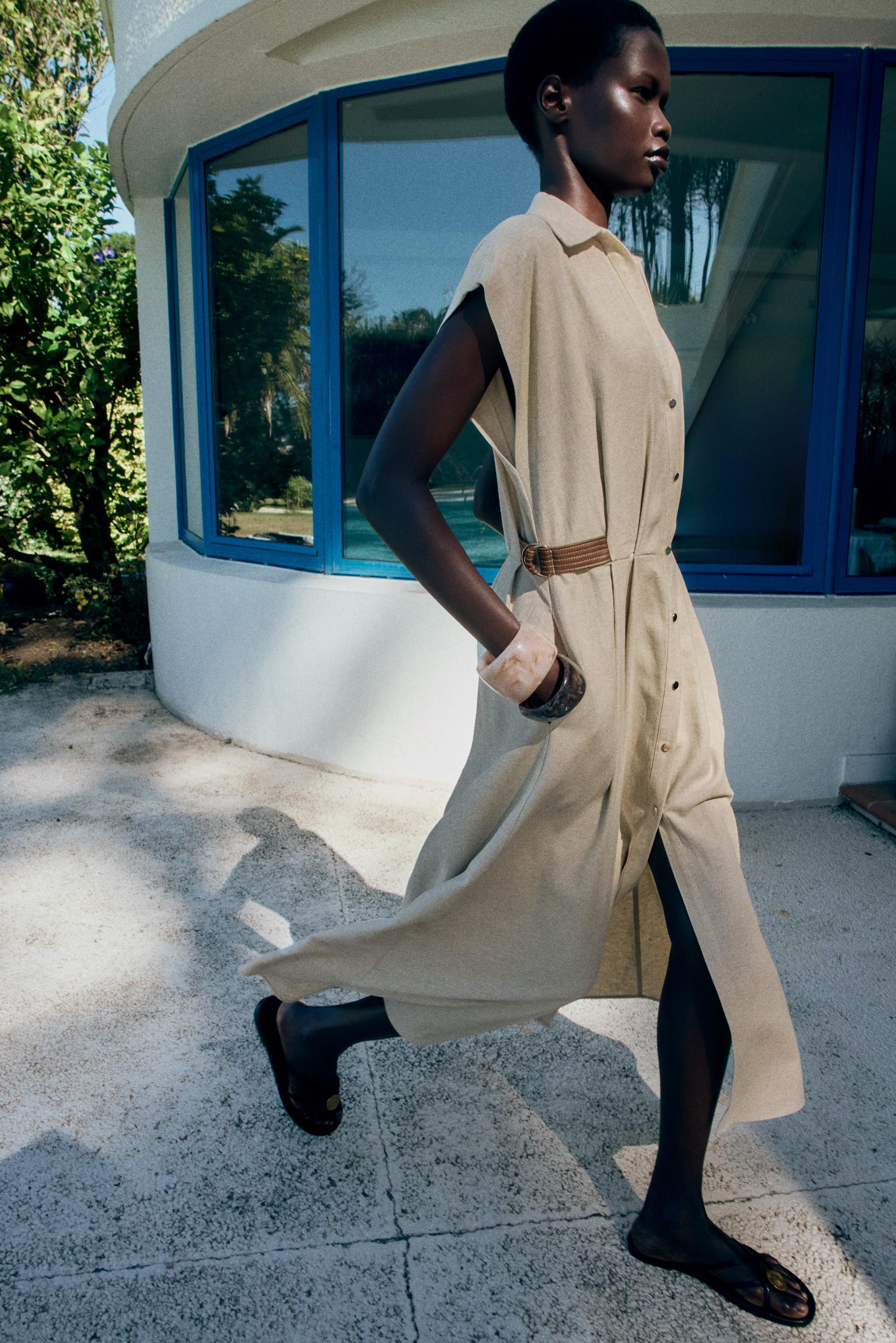 Lapel collar dress with V-neck and sleeveless design. Waist dart detail and side belt loops. Elas... | Zara US