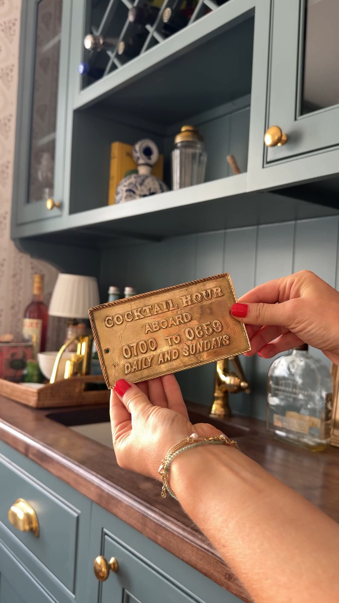 I had to have this cheeky brass plaque, but now I can’t decide where it lives. I'd love to find a home near the bar without drilling into cabinets, but I also thought the Dutch door could be fun. However, it just barely fits...the front door feels odd as an exit as its a welcoming piece, and under the dinner bell might be brass overload. So—where would you put it? And ignore the shakes…too many last night!

Weigh in with any and all ideas below! In the meantime, shop the sign and my space by commenting SHOP