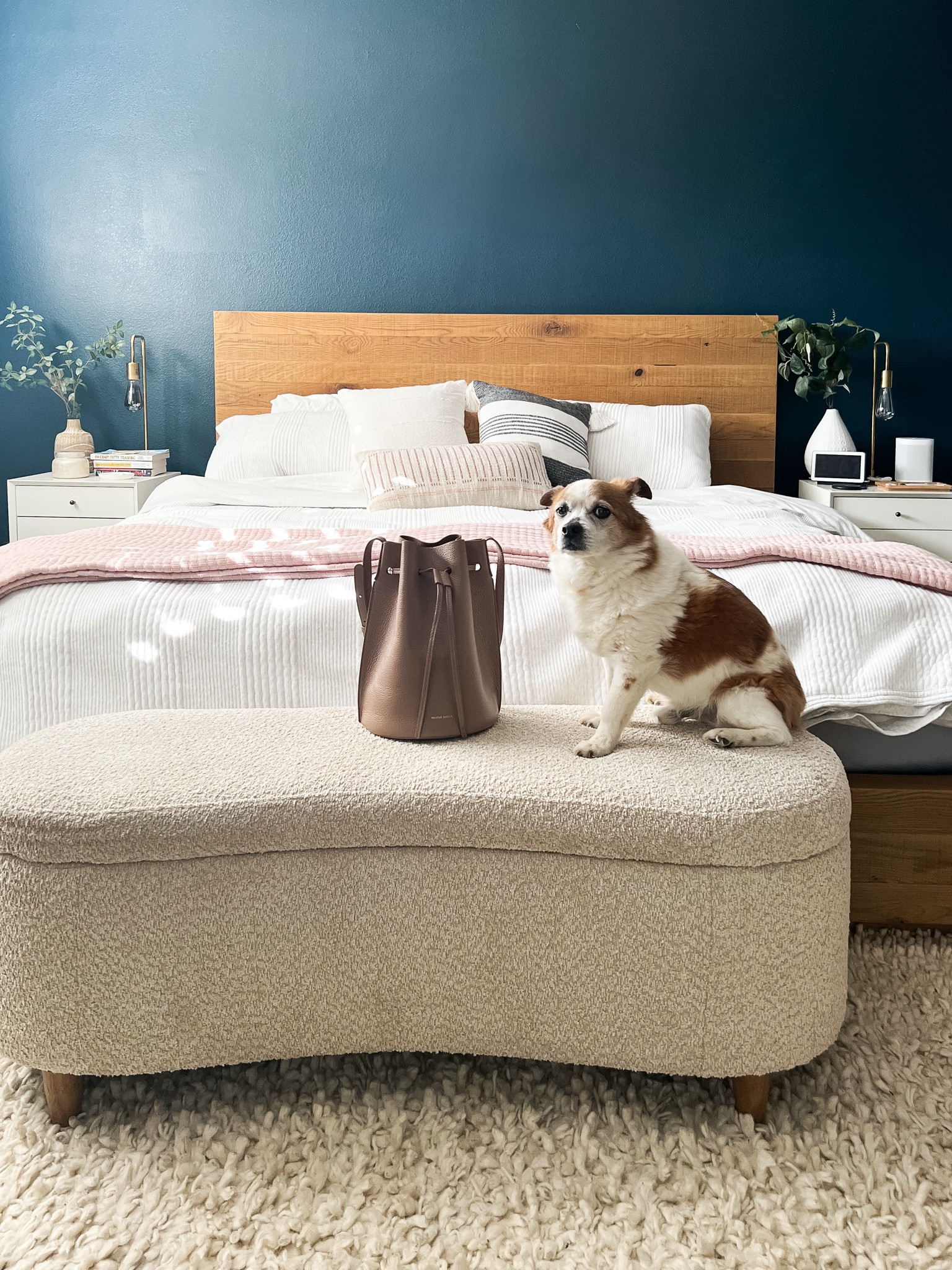 This cream colored end of bed storage bench goes perfectly with our king bed. And our dog loves it too! 
