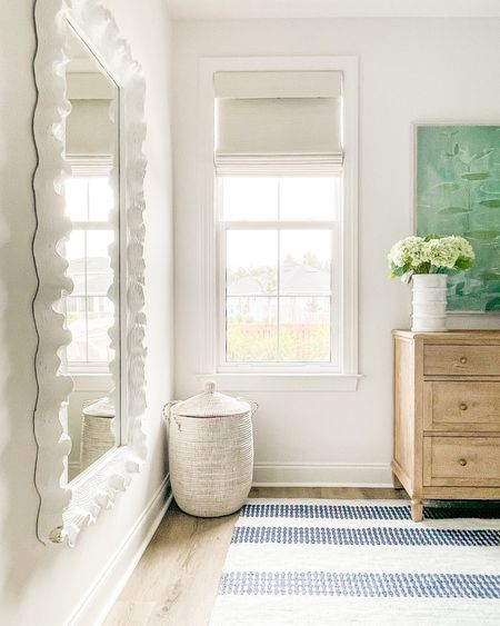 Loving this floor length wavy mirror in our bedroom (it also comes in a smaller size)! Also linking our striped rug, light wood dresser, colorful lily art, marble vase, faux hydrangeas (these are the light green option) and woven laundry basket. . primary bedroom decor, spring decorating

#ltkhome #ltkseasonal #ltksalealert #ltkunder50 #ltkunder100 #ltkstyletip #ltkfind 

#LTKhome #LTKSeasonal #LTKsalealert #LTKSeasonal #LTKsalealert #LTKhome