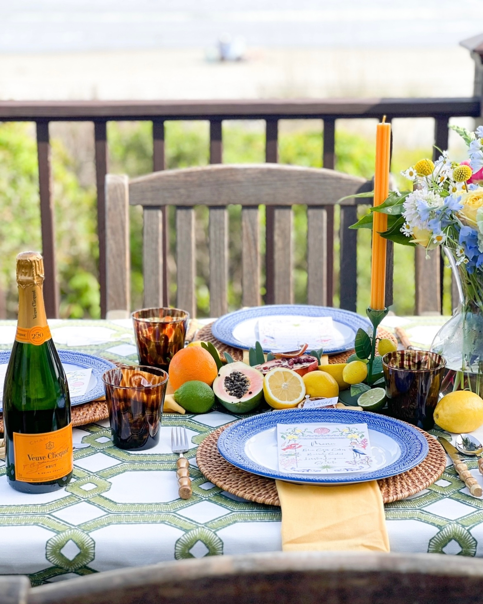 Blue and Green Tablescape! Green and white pattern table cloth, blue and white herringbone plates, woven whicker rattan placemats, woven rattan chargers, bamboo dinnerware, bamboo forks, fruit candle holders, blue and white table, coastal dining, coastal kitchen table, preppy style, southern living style, beach picnic, tortoiseshell cups, garden party

#LTKFind #LTKunder100 #LTKhome