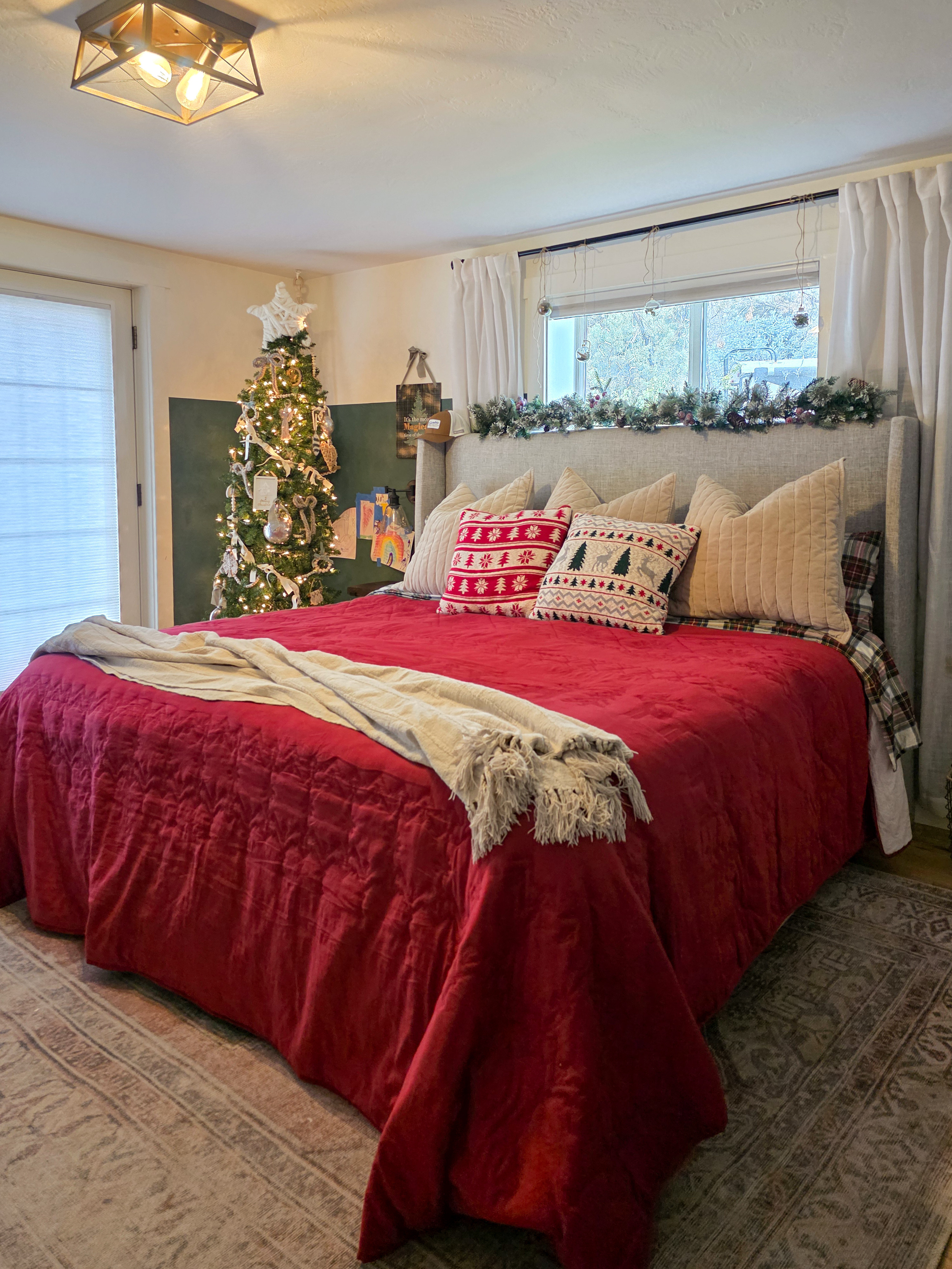 Red comforter, flannel sheets, and the cutest garland over the headboard. Plus the skinny tree doing all the heavy lifting in the corner making this bedroom feel extra cozy and festive! #christmas #christmasbedroom  

 #LTKHoliday #LTKSeasonal #LTKHome