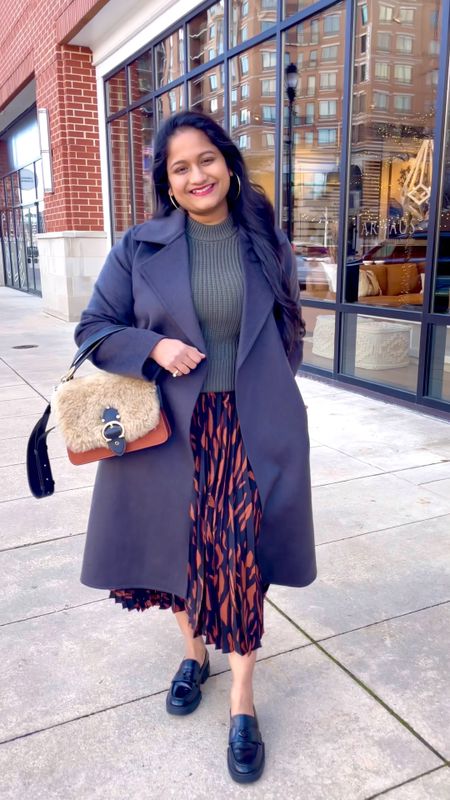 Spring work outfit, spring outfit ideas. 
@Everlane sweater in size S (fits TTS)
@mango printed pleated skirt in size M 
@uniqlo wrap coat in size S (fits loose)

#LTKstyletip #LTKcurves #LTKSeasonal