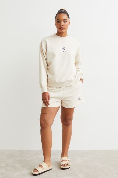 Conscious choice  New ArrivalLightweight, relaxed-fit sweatshirt with a printed design at front. ... | H&M (US)