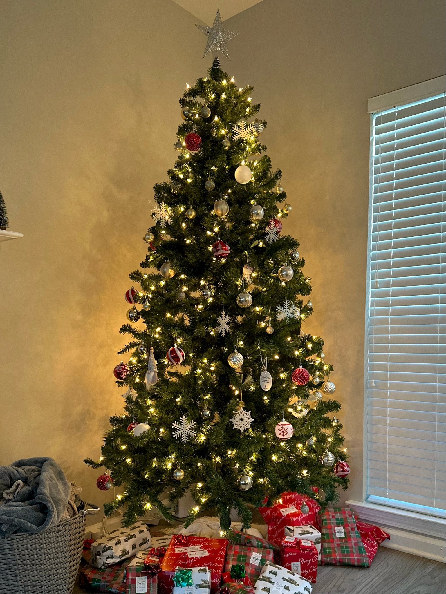 Not the same exact tree as ours, but ours is sold out and possibly discontinued because it hasn’t been in stock for a while. I found a new one which is the same price, also pre-lit, easy assembly but the new one has more lights!! We got this tree in 2020 (our first tree!) and we are still using it this year. The new tree I found has better reviews too, so if you need a good quality tree for an affordable price, this is your tree! 

#LTKGiftGuide #LTKSeasonal #LTKHoliday