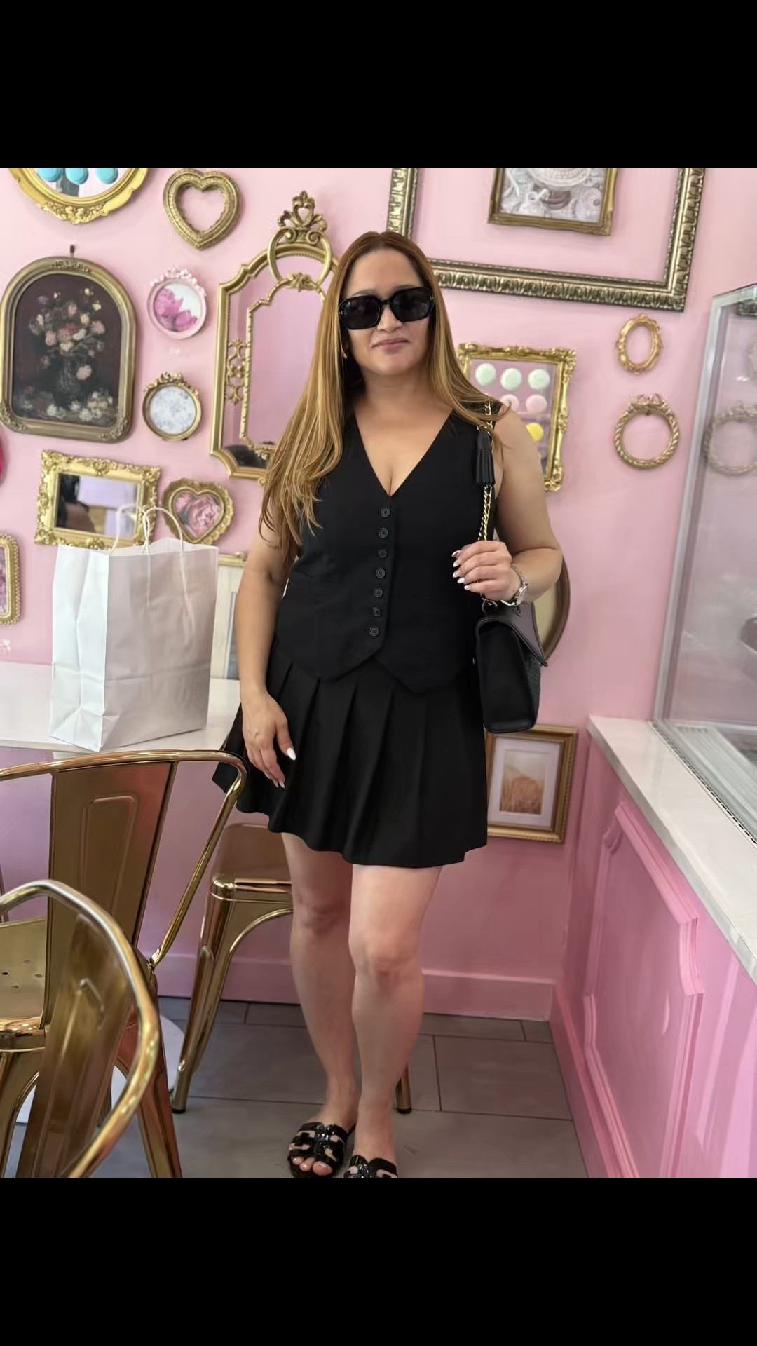 A chic monochromatic look for running errands is achieved by pairing a black skort with a black bottom-down vest and matching accessories. 

#LTKSeasonal #LTKStyleTip #LTKPetite