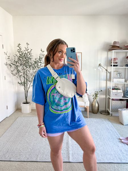 Oversized band tee, spring casual outfit, casual outfit, graphic tee, biker shorts, white sneakers tee, white tee, sneakers, summer style, spring style, lululemon belt bag 

#LTKunder50 #LTKSeasonal