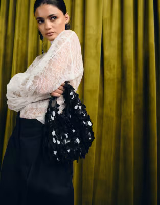 Accessorize sequin fringe handheld bag in black | ASOS | ASOS (Global)