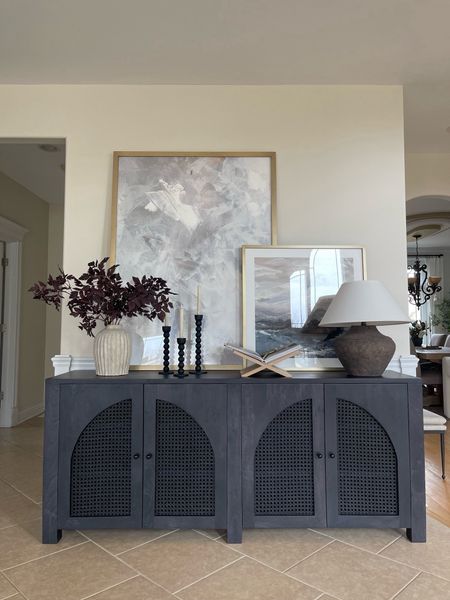 My favorite splurge worthy sideboard and how I styled it! When styling a sideboard I love to use height for visual interest and here I layered two art pieces. I also love using different textures and earthy tones to create a cohesive look. 

#LTKSaleAlert #LTKHome #LTKStyleTip
