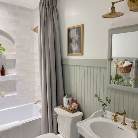 Bathroom design. Brushed brass tub and shower combo. Brushed brass bathroom faucet. Pedestal sink. Brass vanity light. Bathroom decor. Long shower curtain. 

#LTKhome #LTKfindsunder100 #LTKfindsunder50