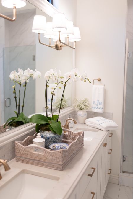 Bathroom vanity & accessories! #bathroom #homedecor #orchid #towels #weezietowels #scallops #tray #rattan #lighting #blue&white #gingerjar