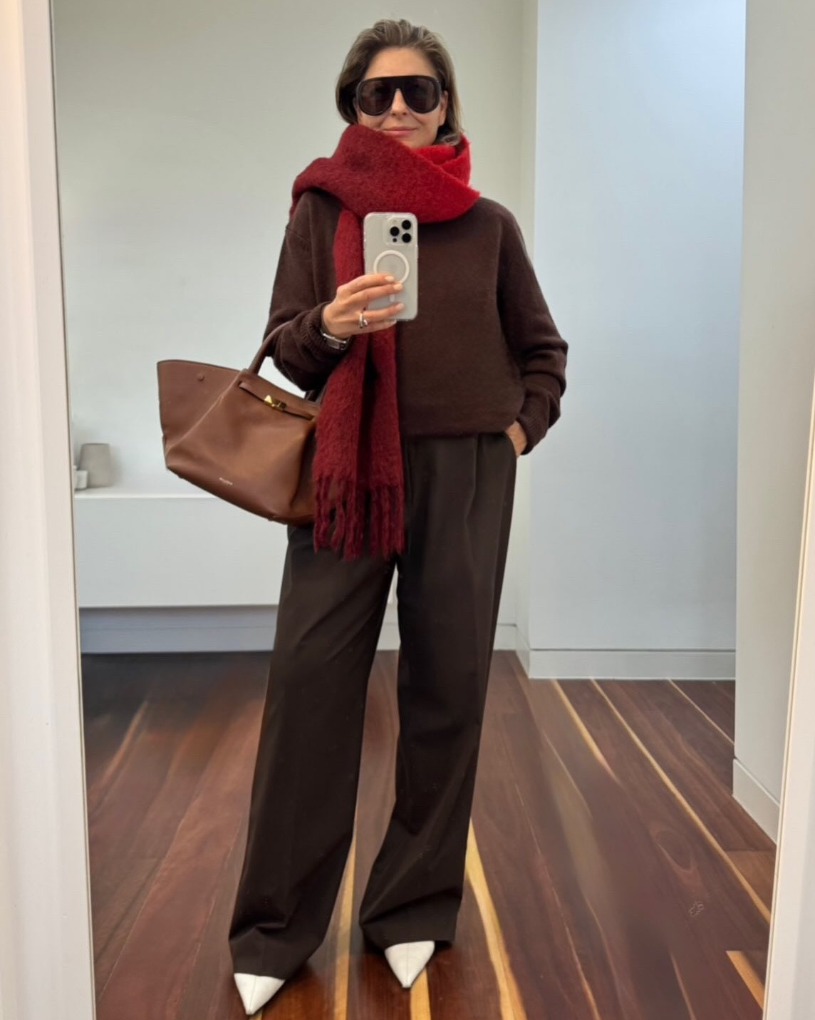 A touch of red ! 
It’s something I’ve been talking about for a while now : 
a pop of colour that will easily & effortlessly slide into your current wardrobe . 

How so ?

Because red looks great with chocolate brown , the new colour combination of the season. 

The best way to wear red : 
Accessories of course ! 

I nabbed this fabulous red wool scarf @netaporter : a stand out piece of colour that instantly updates your wardrobe.
(And it might just keep you warm too!)

But don’t just stop at a red scarf , you can also rock a red shoe, a red bag or try a red knit tied around your waist. 
Love red hosiery and the idea of a bright red lipstick !

The trick is to just have one single piece in red and keep it as the centre of attention. Then build a wardrobe around it that’s simple, easy & chic. From choc brown pants & white shoes to a leather skirt & boots . 

You can find this fabulous scarf @netaporter plus lots of other fantastic accessories on sale with another 15% off ; yes, please !

#LTKaustralia #LTKwinter #LTKstyletip