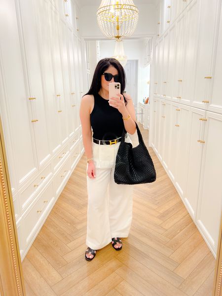 The perfect summer outfit 🤍. Still obsessing over this beautiful bag that’s under $160! These are some of my favorite sunglasses, under $80. 

Black tank top, le specs, sunglasses, white linen pants, linen, Hermes belt, Oran sandals, summer outfit, summer look 

#LTKunder50 #LTKunder100 #LTKsalealert