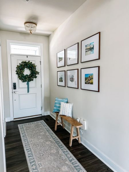 It’s taken awhile for us to figure out our hallway but we finally found the perfect entryway solution. I grabbed some brown frames for a gallery wall on Amazon and a narrow entry bench for such a small space. Treating this entry space for an open concept home as its own room helped me finally figure out the right decor for this small entryway. 

Grandmillenial rug
Preppy rug
Entry bench
Narrow bench
Gallery wall
Boho lights
Spring wreath 
Spring pillows 
Boho lights
Beaded chandelier 

#LTKSpringSale #LTKSeasonal #LTKhome