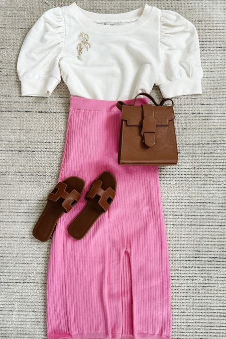 Spring casual outfit with ribbed midi skirt and white puff sleeve shirt! Love the pop of bright colors for spring wear. This exact shade of skirt is sold out, but very similar colors are still available. Linking shoes and accessories, too 

#LTKSeasonal #LTKstyletip