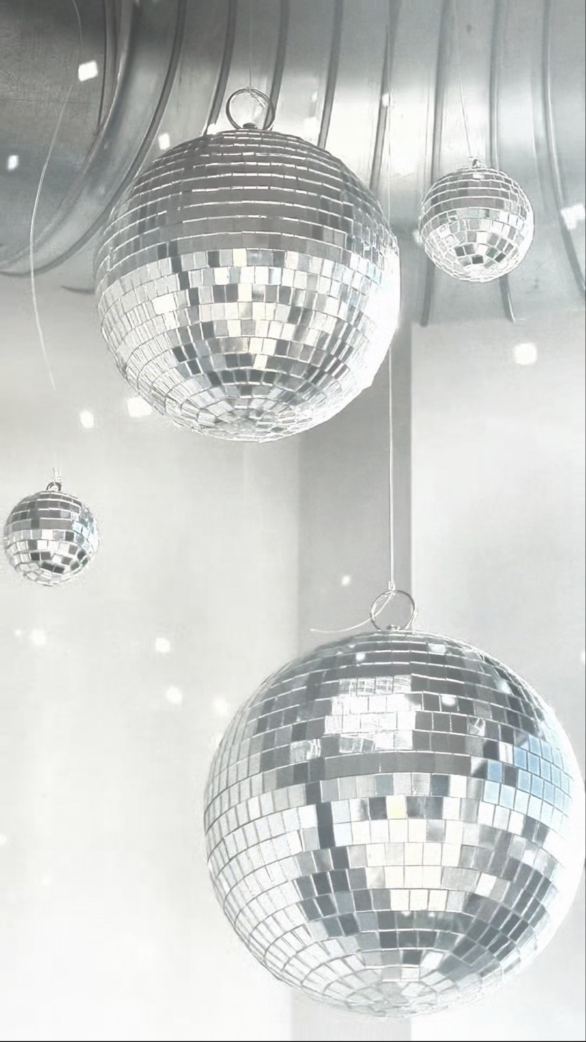 Disco balls make everything better. Disco ball decor and party decorations are a whole personality.

For this installation I used 6 different disco balls and hung them from my ceiling! I love how the light reflects off of them in the morning at sunrise and at sunset at night. The reflections dance on my walls all day long and it makes me so happy ☺️✨🪩

#LTKvlog #LTKdayinmylife #LTKHome