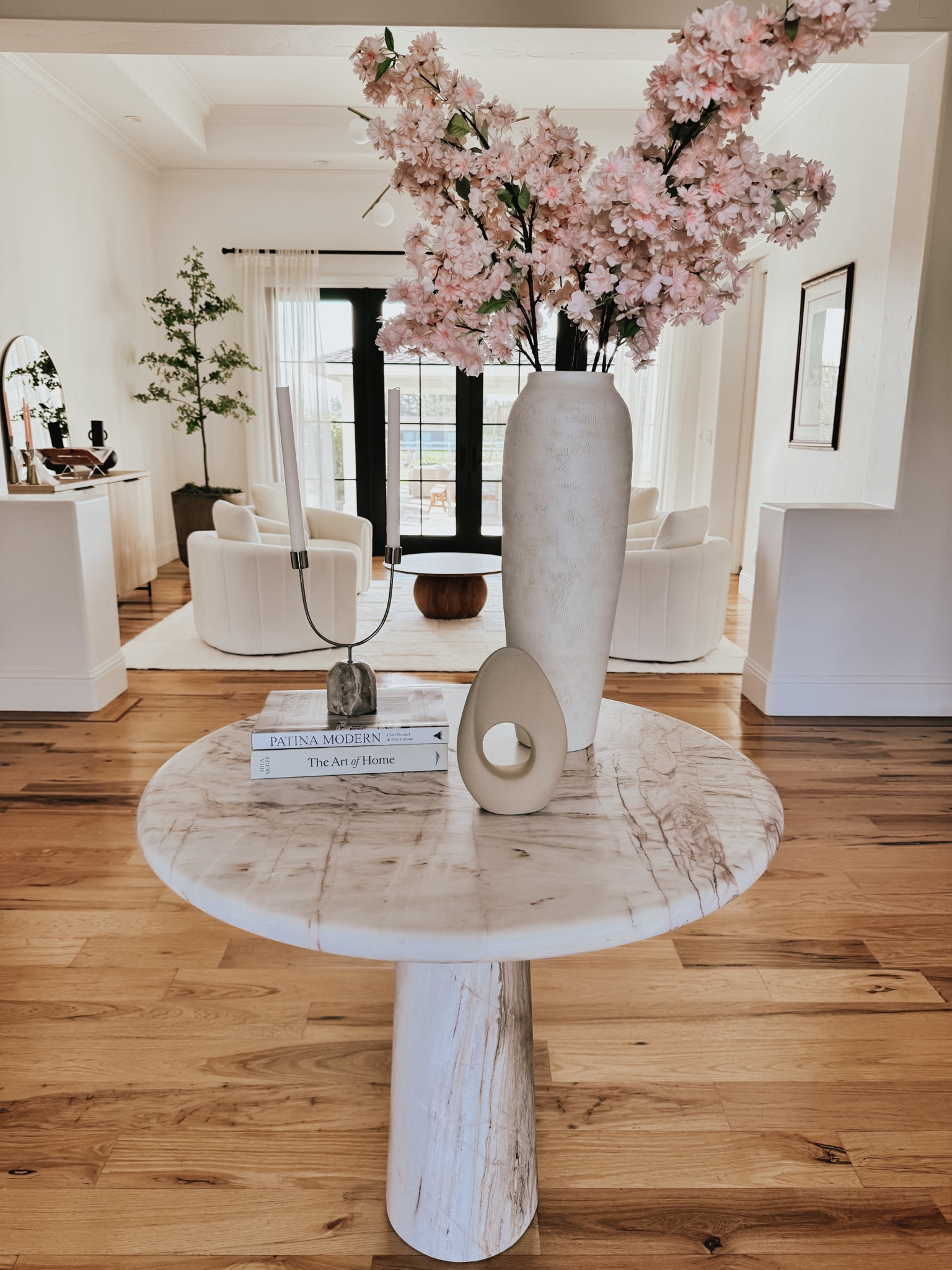 Entry way pedestal table decorated with branches and candles 

#LTKsalealert #LTKhome #LTKSpringSale