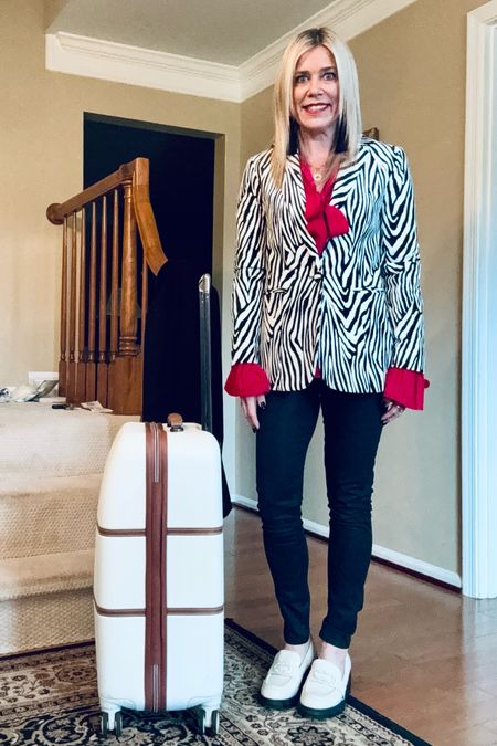 Jet-setting in style. This is an older @frame blazer @alexis blouse. Tagging similar looks with my coated denim and luggage. This look is perfect for winter travel or going out in winter.

#LTKSeasonal #LTKstyletip #LTKtravel
