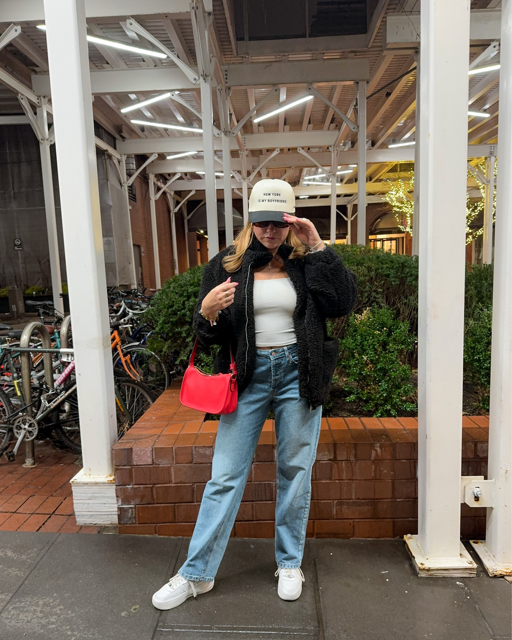 Effortless street style inspo ✨ Rocking cozy layers with a pop of red for that winter-chic vibe ❄️ Pairing classic denim and a sleek white tank with a teddy jacket and trendy accessories to elevate your everyday look. Save this for your next casual yet polished outfit idea! 💼👖 

#LTKSeasonal #LTKStyleTip #LTKSaleAlert