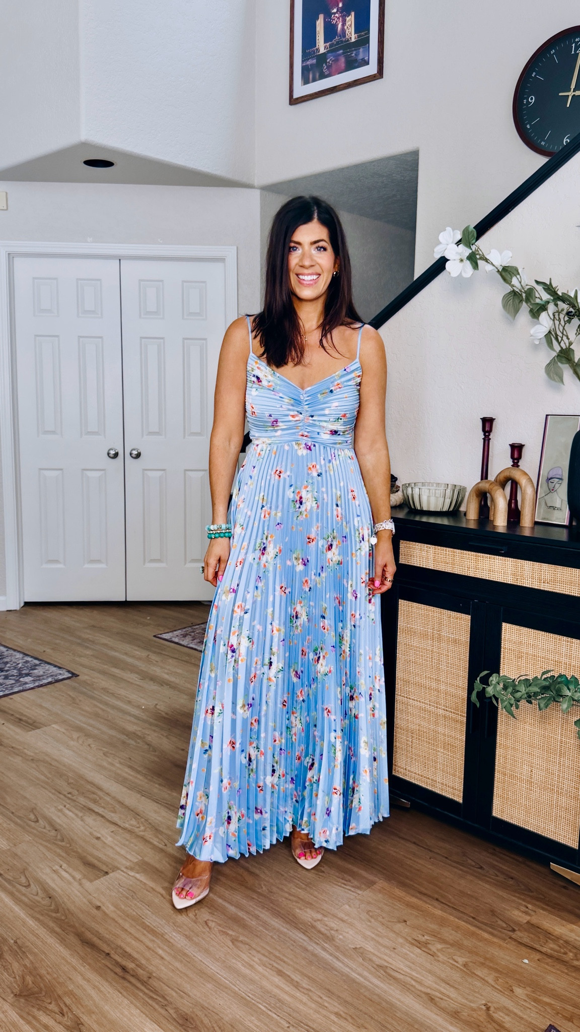 In a medium pleated floral dress

#LTKMidsize #LTKWedding #LTKTall