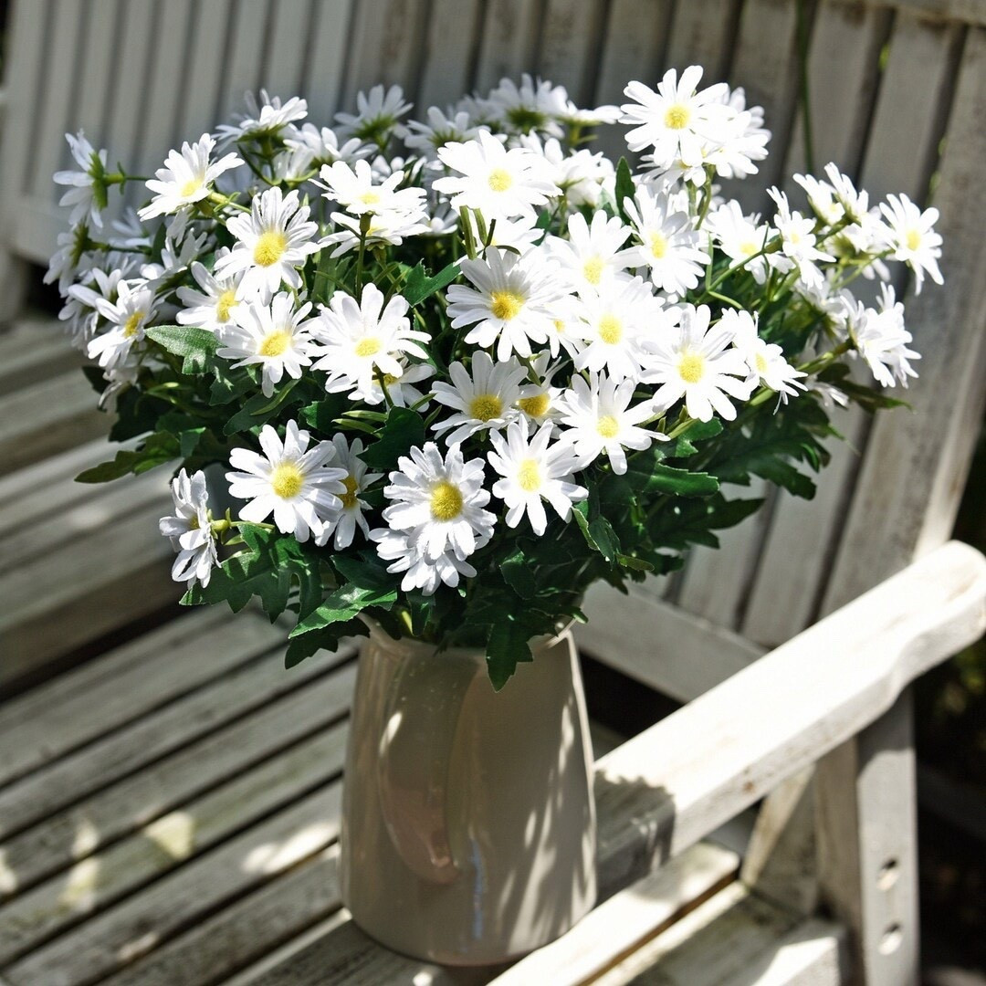 Bright, cheerful, and effortlessly classic, this white daisy bouquet brings the fresh-picked look indoors all year long. With full bundles, bendable stems, and removable blooms, these lifelike silk flowers are perfect for centerpieces, DIY crafts, or everyday home décor. Easy to style and always in bloom, they add a timeless touch to any space.

#LTKHome #FauxFlowers #DaisyDecor #HomeDecorFinds #SpringDecor #FarmhouseStyle #FloralDecor #CenterpieceIdeas #DIYDecor #KitchenDecor #WeddingDecor #LTKFinds #HomeStyling #GiftIdeas #TimelessDecor

#LTKHome #LTKSeasonal #LTKWedding
