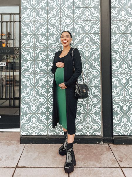 DATE NIGHT OUTFIT: Third trimester inspo for your next date night. I was excited to pair this together for a little lunch date last week, but I’d definitely switch out the boots for heels if it hadn’t been raining. 
This black duster has been my #1 layering go-to this month. A good piece for mamas who like to look elegant yet feel a bit more covered up. 

#LTKbump