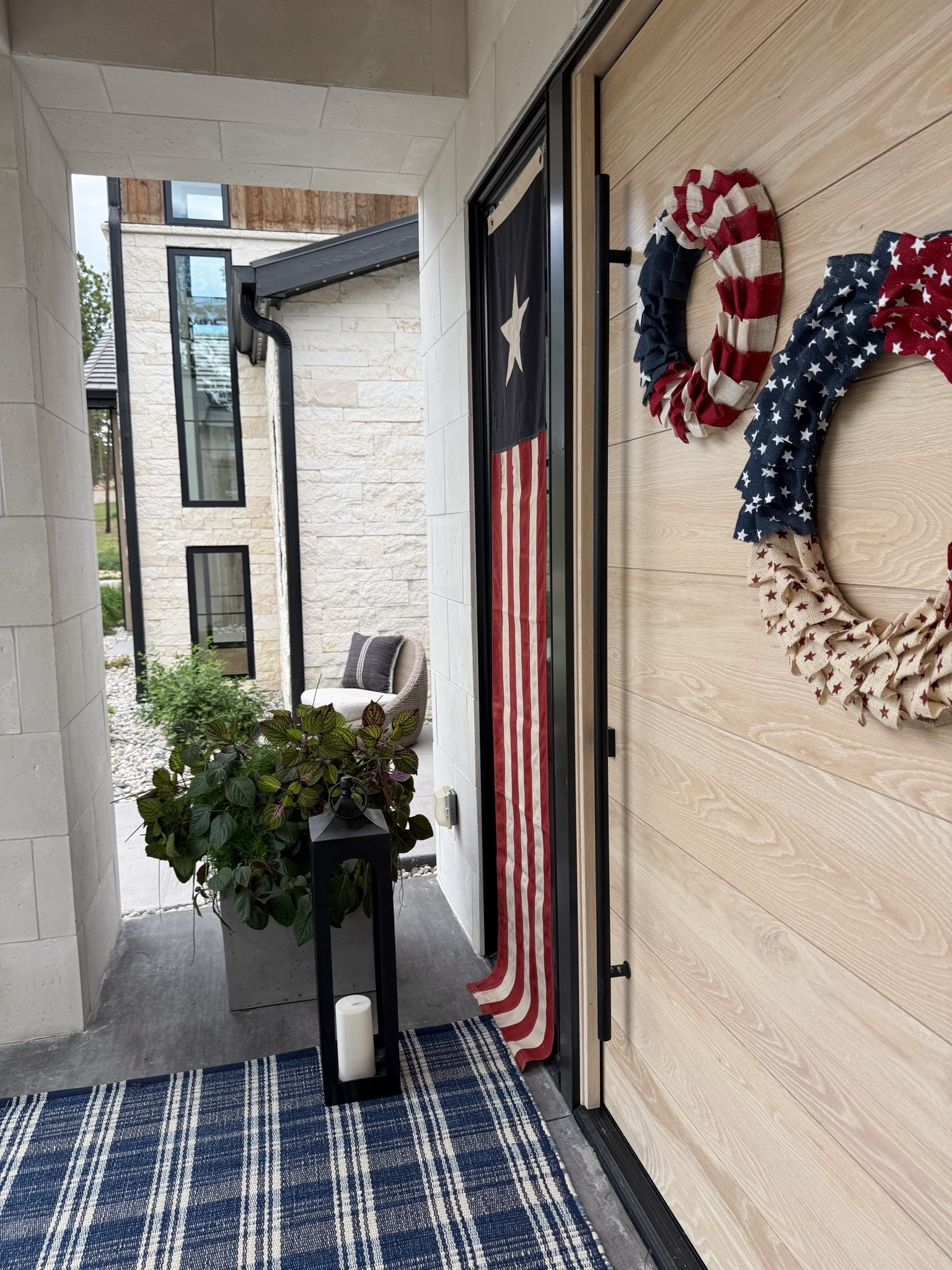 Fourth of July details. Love this double wreath moment! Super easy to hang with an outdoor command hook. I used suction cup hooks for the banner flags over the windows. The quality of this outdoor rug is amazing.

#LTKdayinmylife #LTKSeasonal #LTKHome