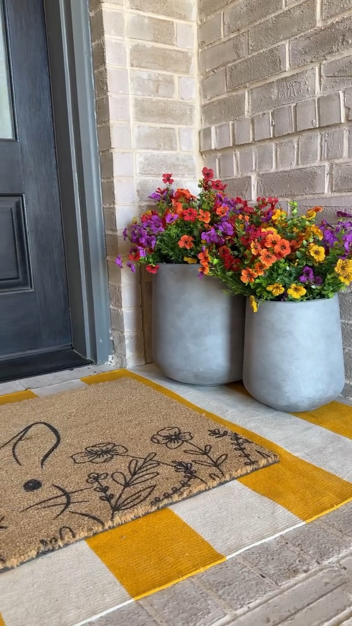 budget friendly spring front porch 🌷 & I went with the fake flowers hack so they will last all season and I can reuse them year after year. The wreath and doormats were both a spring Amazon find and so affordable! This was my first time styling a long and narrow front porch for the spring season, let me know what you think!

Comment “spring” for a list of everything I used on our affordable spring front porch decor sent your way! 💌

#springporch #springporchdecor #springfrontporch #addordabledecor #budgetfriendlydecor #outdoorspringdecor #amazonhome #amazonhomefinds #easterfrontporch refresh the front porch for spring. Spring front porch refresh. Spring front porch ideas. Spring front porch. Decorate my front porch for spring with me.