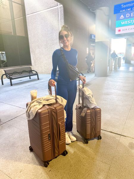 Travel outfit from Skims! I am wearing a small in both my top and bottoms - I am wearing a size 10 in the Nike RYZ’s! My favorite luggage ever is Beis and I have the large 28” check in luggage and the carry on roller luggage! 

#LTKshoecrush #LTKstyletip #LTKtravel
