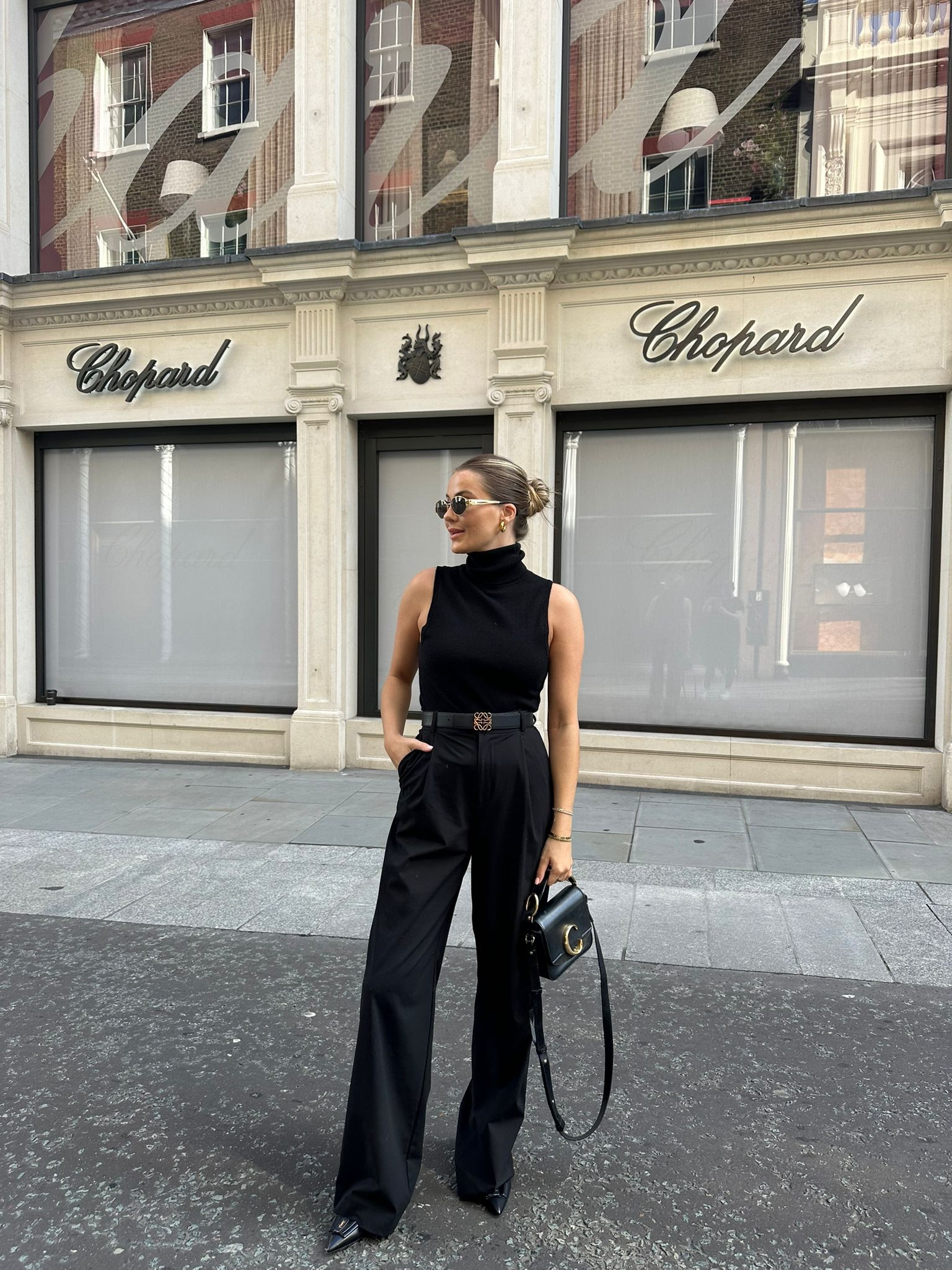 All black early autumn street style outfit - smart black straight leg trousers from Reiss, H&M premium cashmere polo neck sleeveless knit vest, Loewe black reversible belt, ysl pointed flats, Chloe mini c bag & Céline metal triomphe sunglasses  

#LTKSeasonal #LTKstyletip #LTKeurope