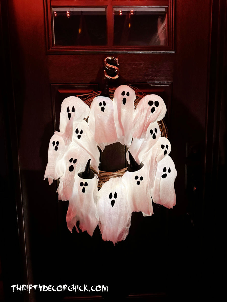 How to make the viral DIY ghost wreath for WAY less! This version is made with plastic ornaments, cheesecloth and LED lights.  

 #LTKHalloween #LTKSeasonal #LTKHome